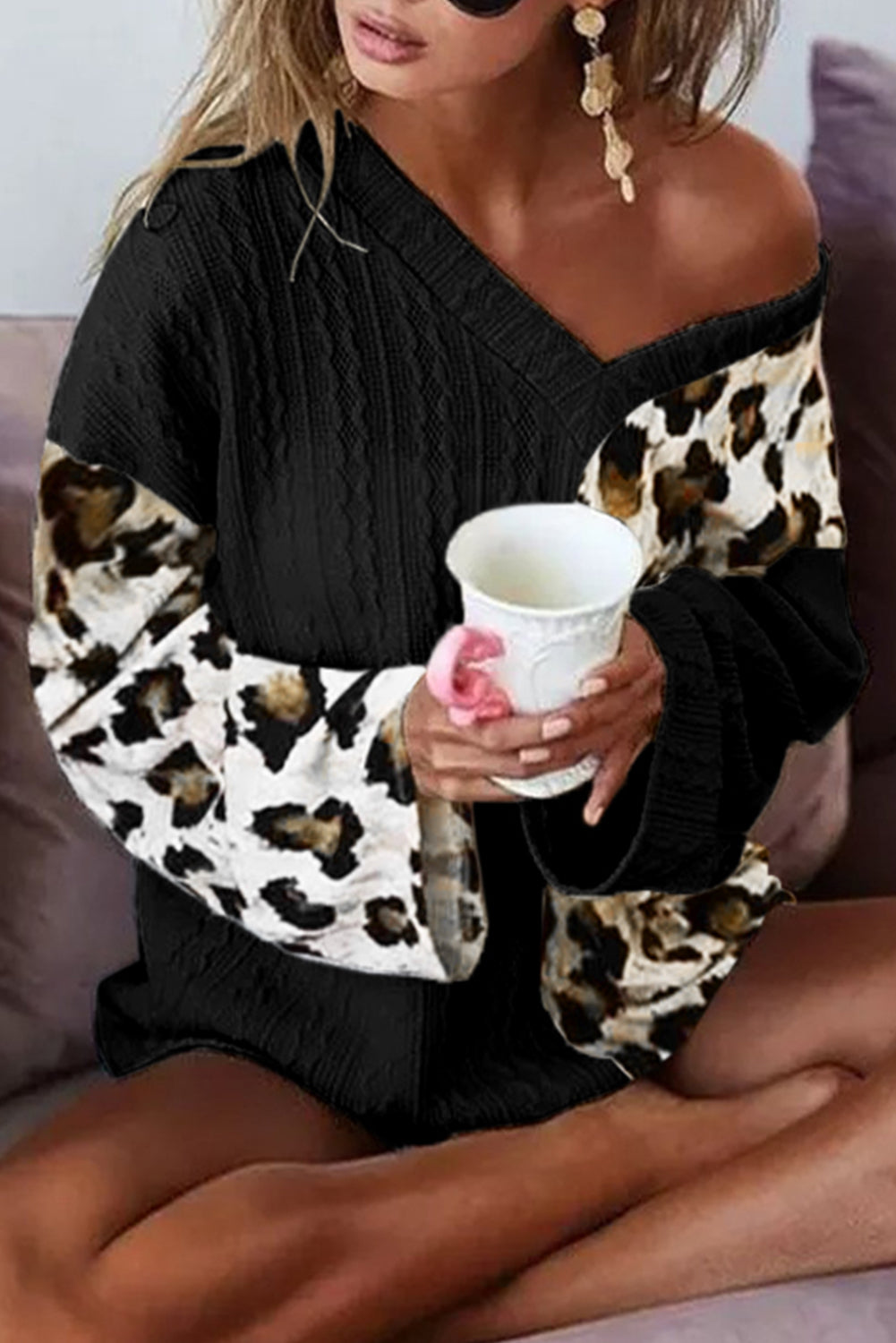 Black Asymmetric Leopard Patchwork Wide Sleeve V Neck Sweater showcasing a stylish design with leopard print splicing and wide sleeves.