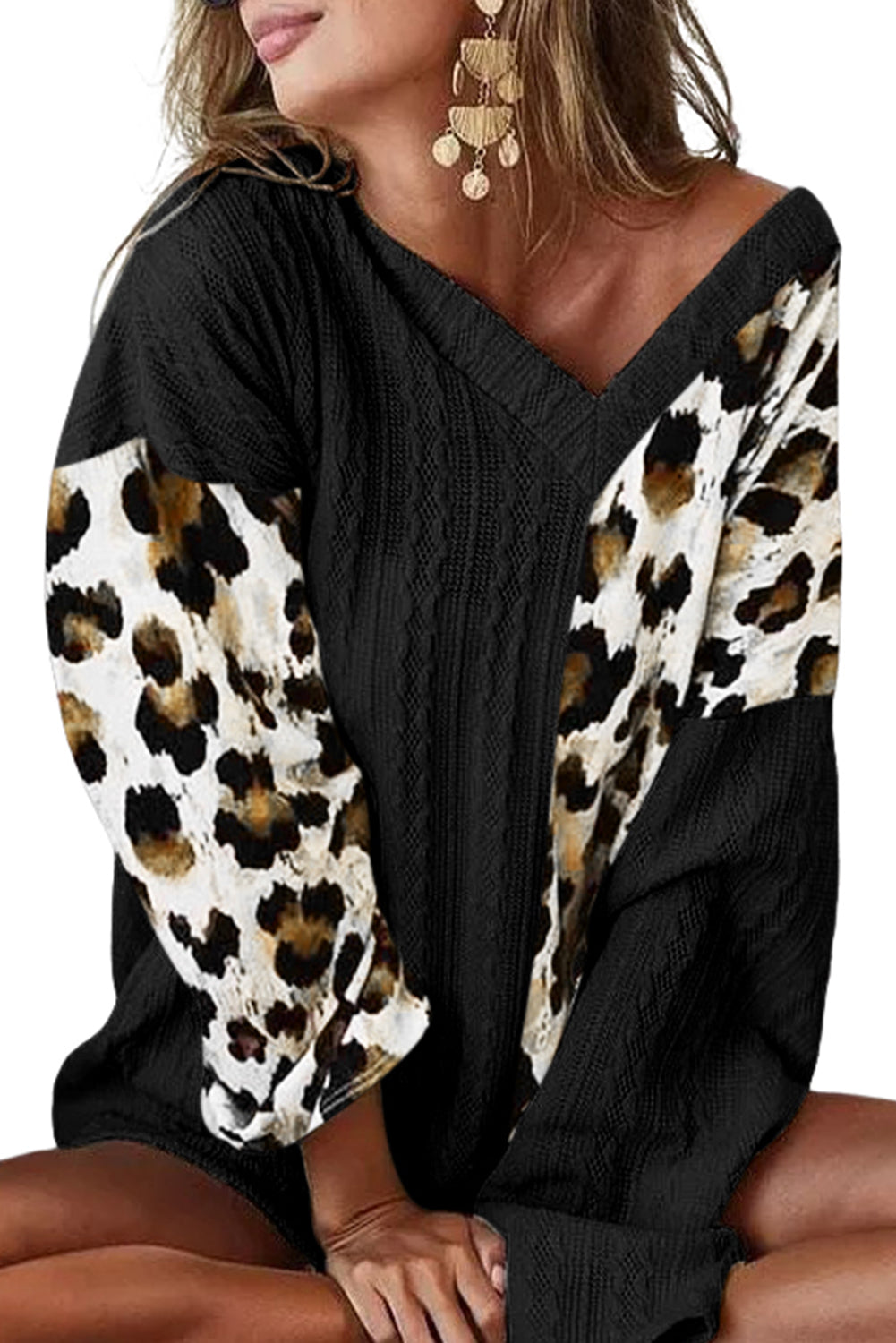 Black Asymmetric Leopard Patchwork Wide Sleeve V Neck Sweater showcasing a stylish design with leopard print splicing and wide sleeves.
