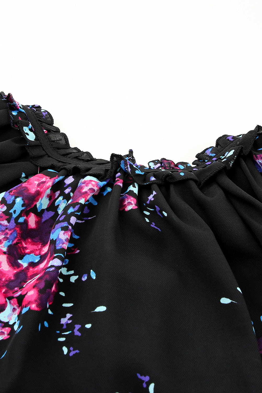 Black blouse with butterfly sleeves and split V-neck, featuring a colorful tie-dye print, perfect for stylish women.