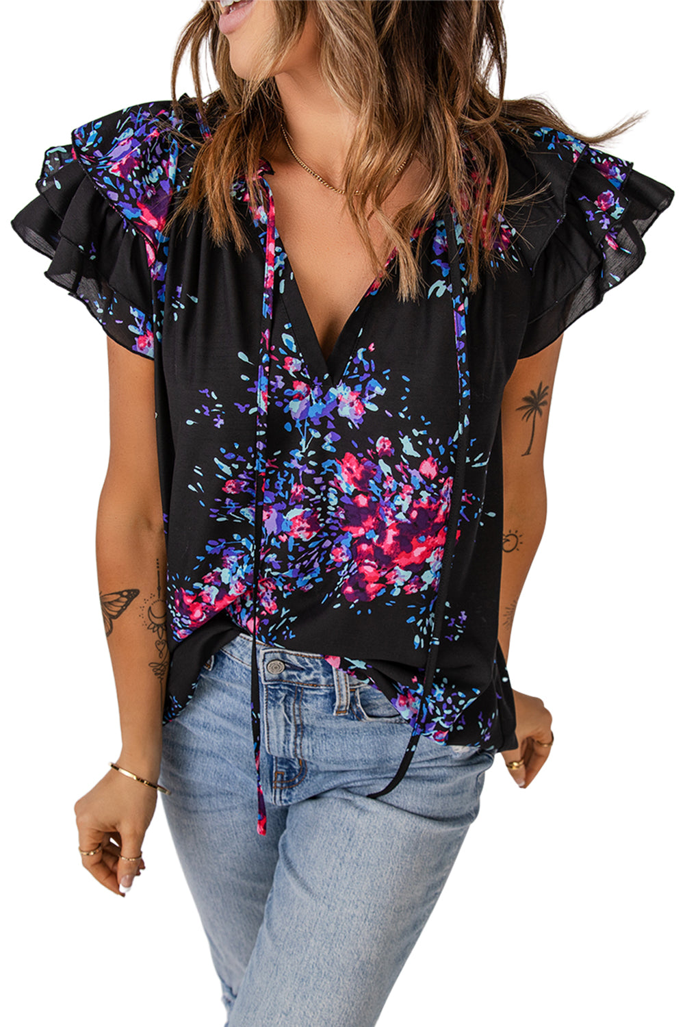 Black blouse with butterfly sleeves and split V-neck, featuring a colorful tie-dye print, perfect for stylish women.
