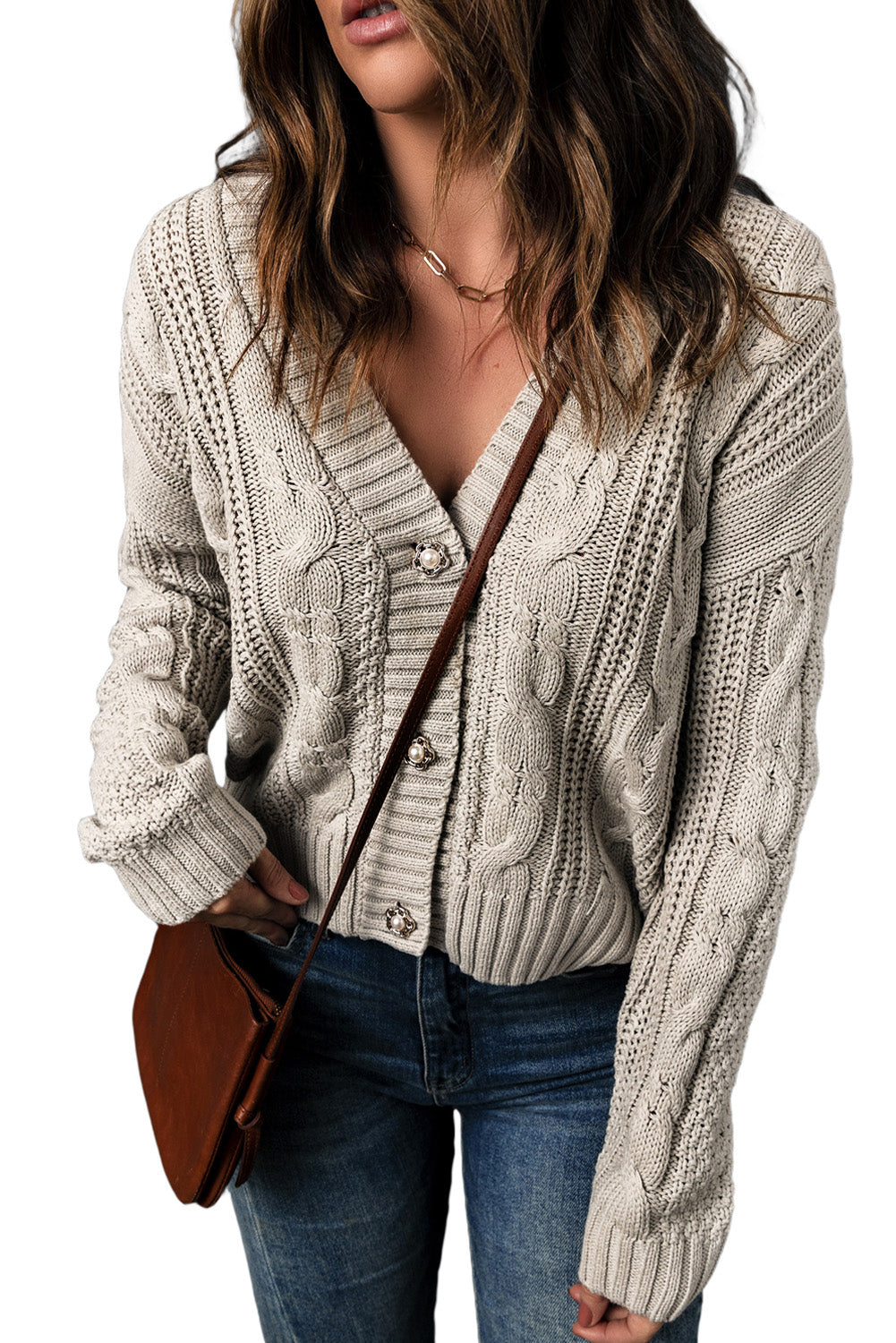 A stylish black knit cardigan featuring button closures, deep v-neck, and long drop-shoulder sleeves, perfect for layering in cold weather.