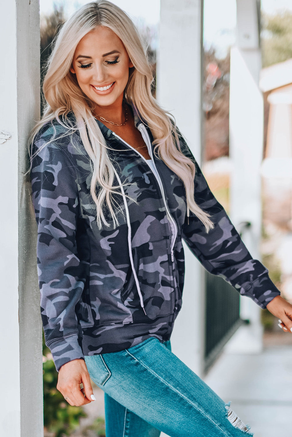 Black camo print zip-up hooded coat with pockets, showcasing a stylish design suitable for casual wear.