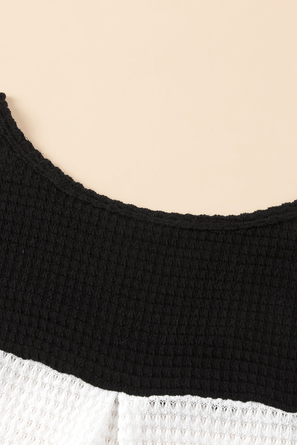 Black Contrast Color Waffle Knit Long Sleeve Top featuring a stylish colorblock design and waffle knit texture, perfect for layering.