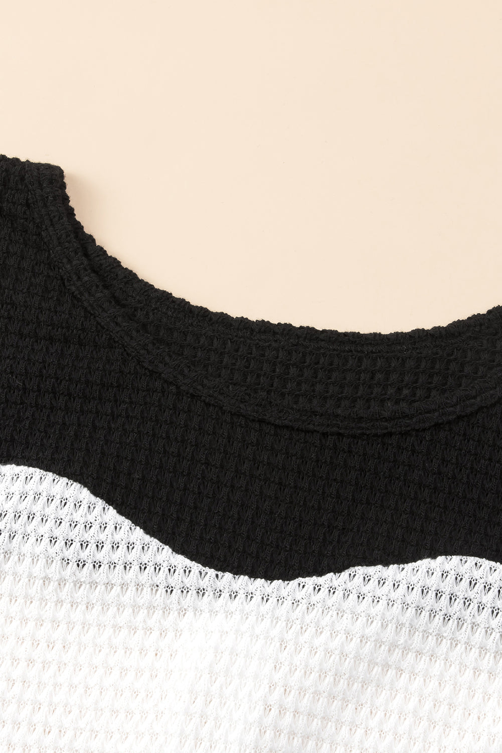 Black Contrast Color Waffle Knit Long Sleeve Top featuring a stylish colorblock design and waffle knit texture, perfect for layering.