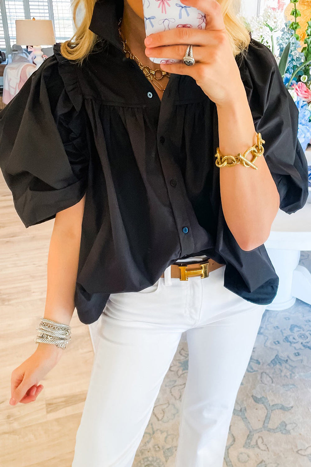 Black Crisp Puff Sleeve Loose Shirt displayed on a mannequin, showcasing its elegant puff sleeves and loose fit.