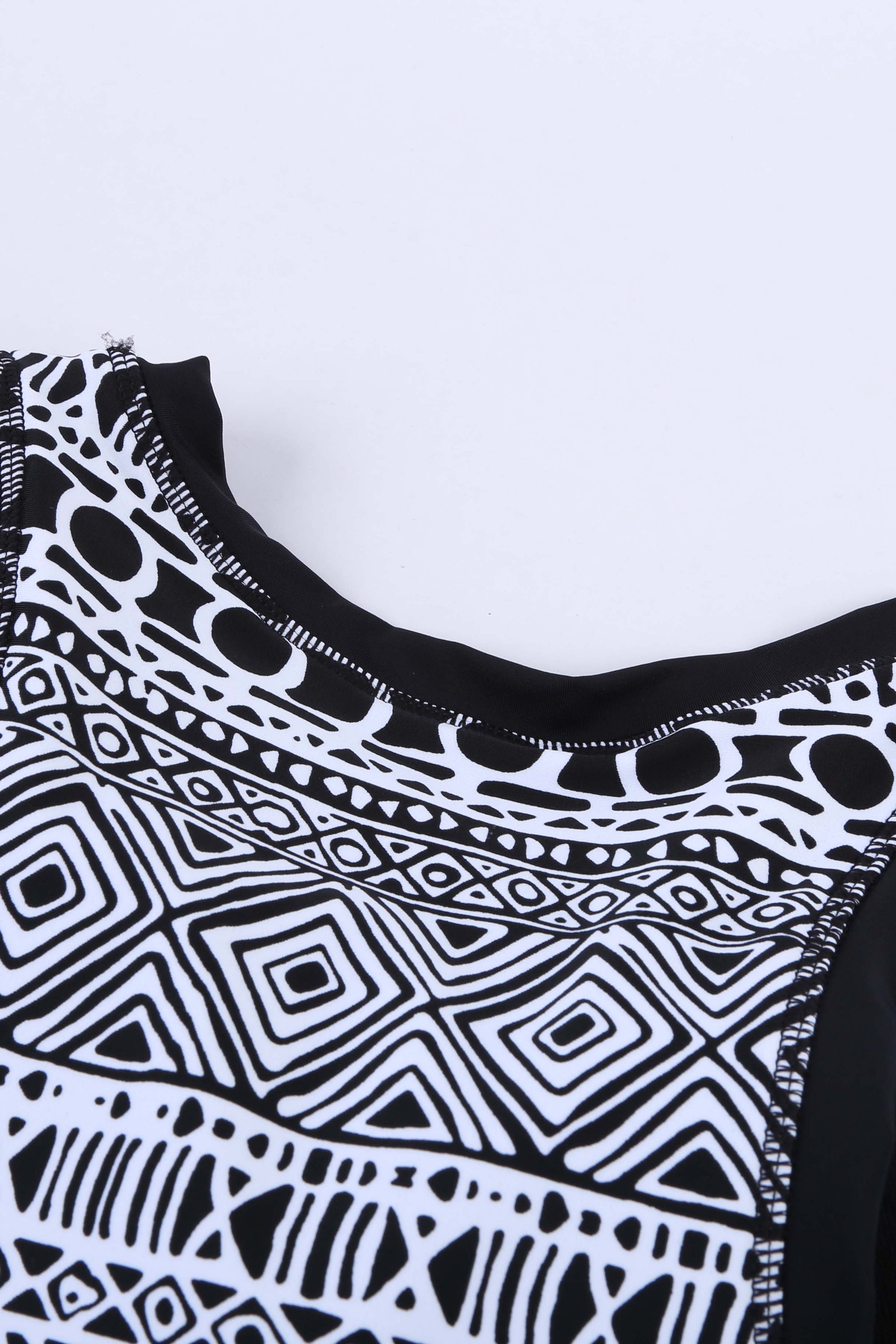 Black ethnic print high neck strappy tankini top designed for stylish swimwear with body shaping control.