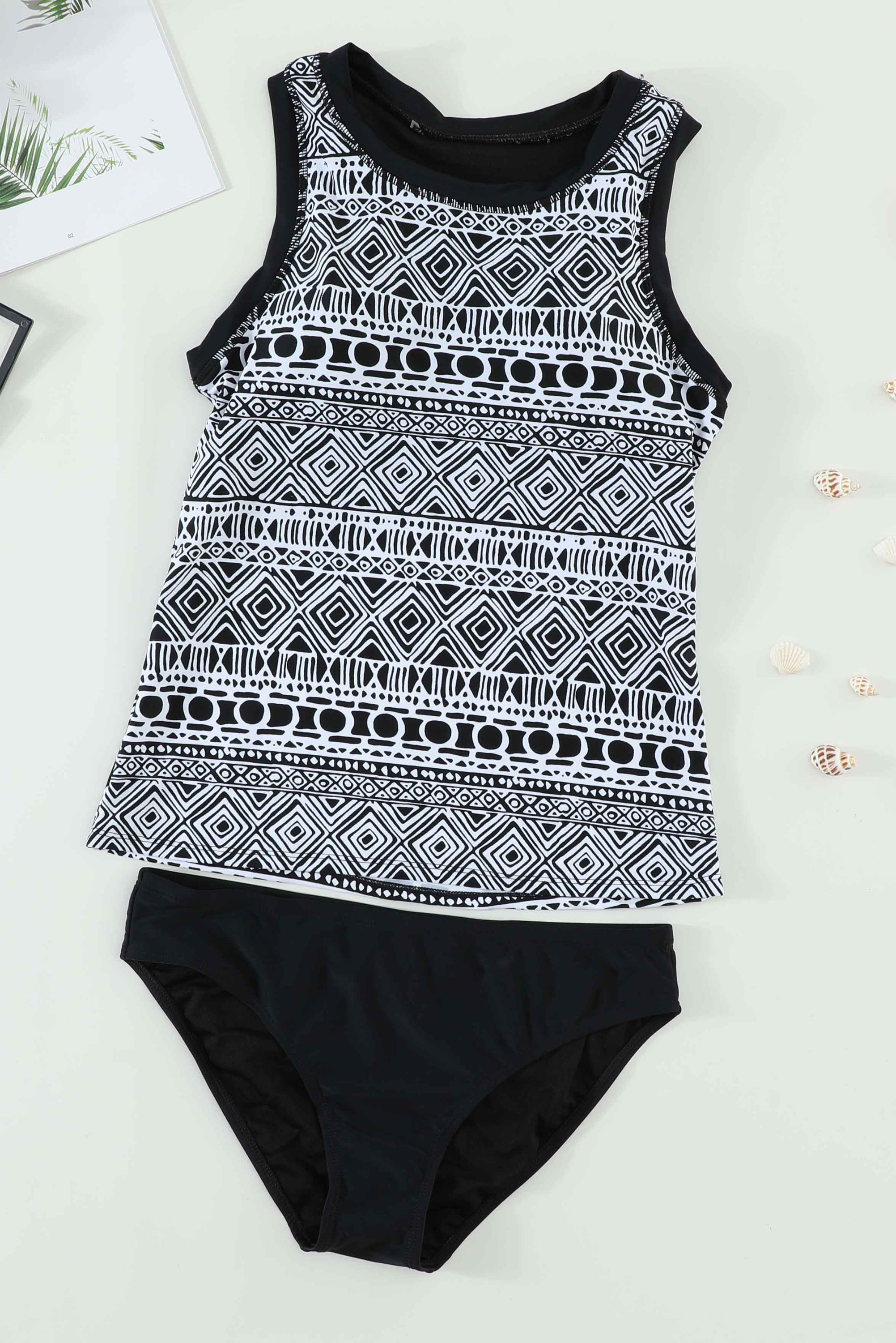 Black ethnic print high neck strappy tankini top designed for stylish swimwear with body shaping control.