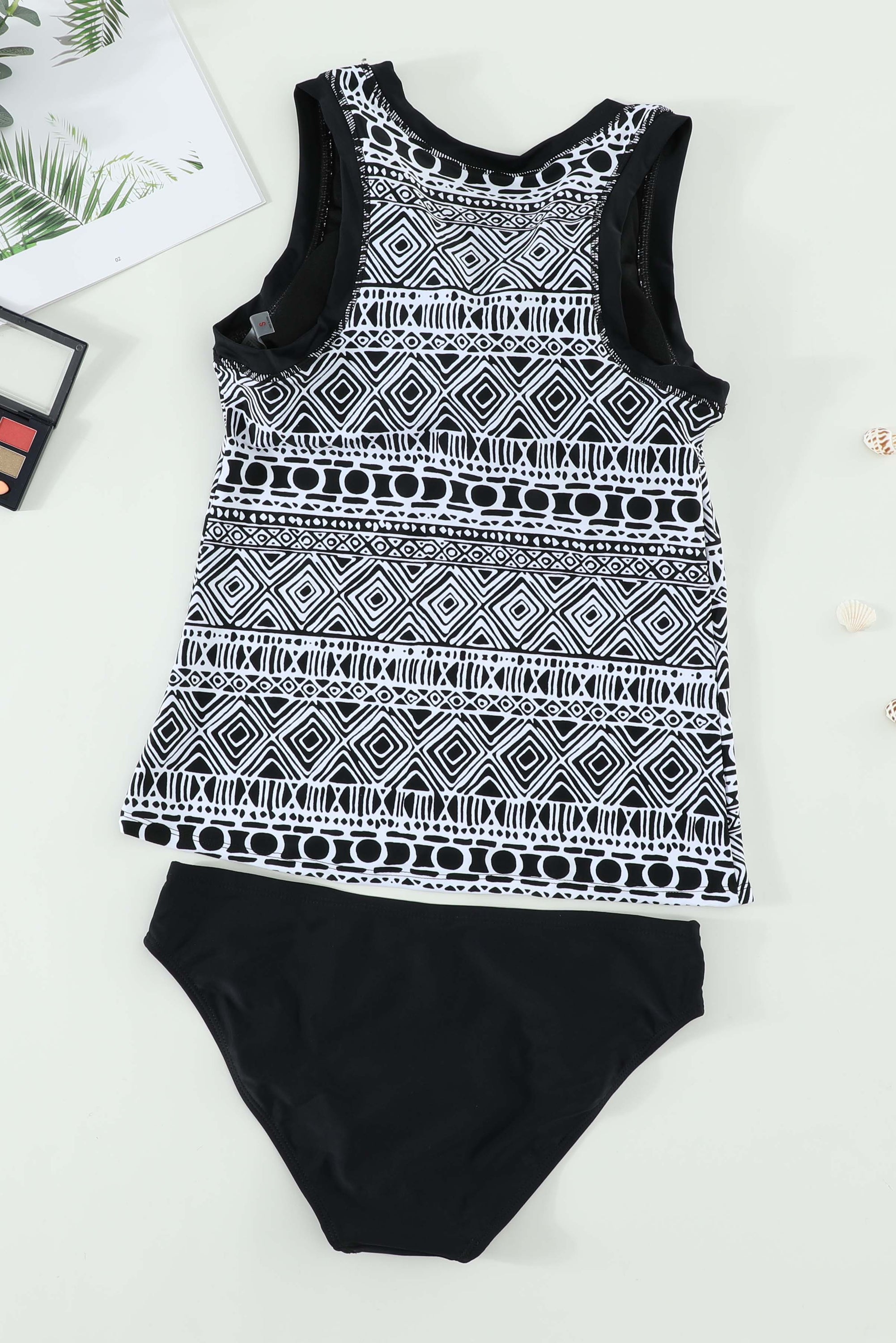Black ethnic print high neck strappy tankini top designed for stylish swimwear with body shaping control.