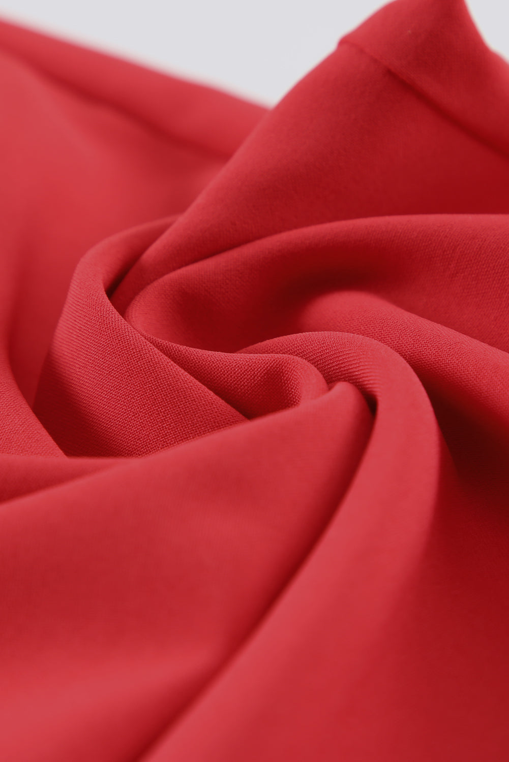 A stylish black jumpsuit featuring flutter sleeves, a smocked bodice, and wide leg bottoms, perfect for any occasion.