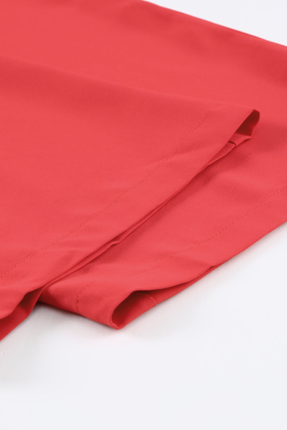 A stylish black jumpsuit featuring flutter sleeves, a smocked bodice, and wide leg bottoms, perfect for any occasion.