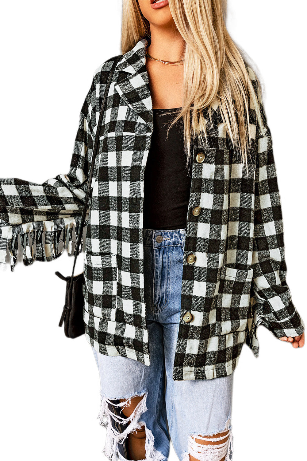 Black fringed plaid print shacket featuring a classic black and white pattern, collared neckline, and stylish fringe details on sleeves.