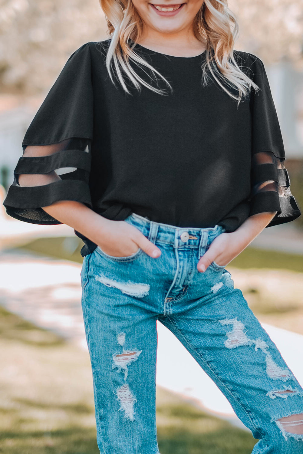 Black Girl's 3/4 Bell Sleeve Mesh Panel Blouse featuring sheer mesh panels and a stylish peek-a-boo back.