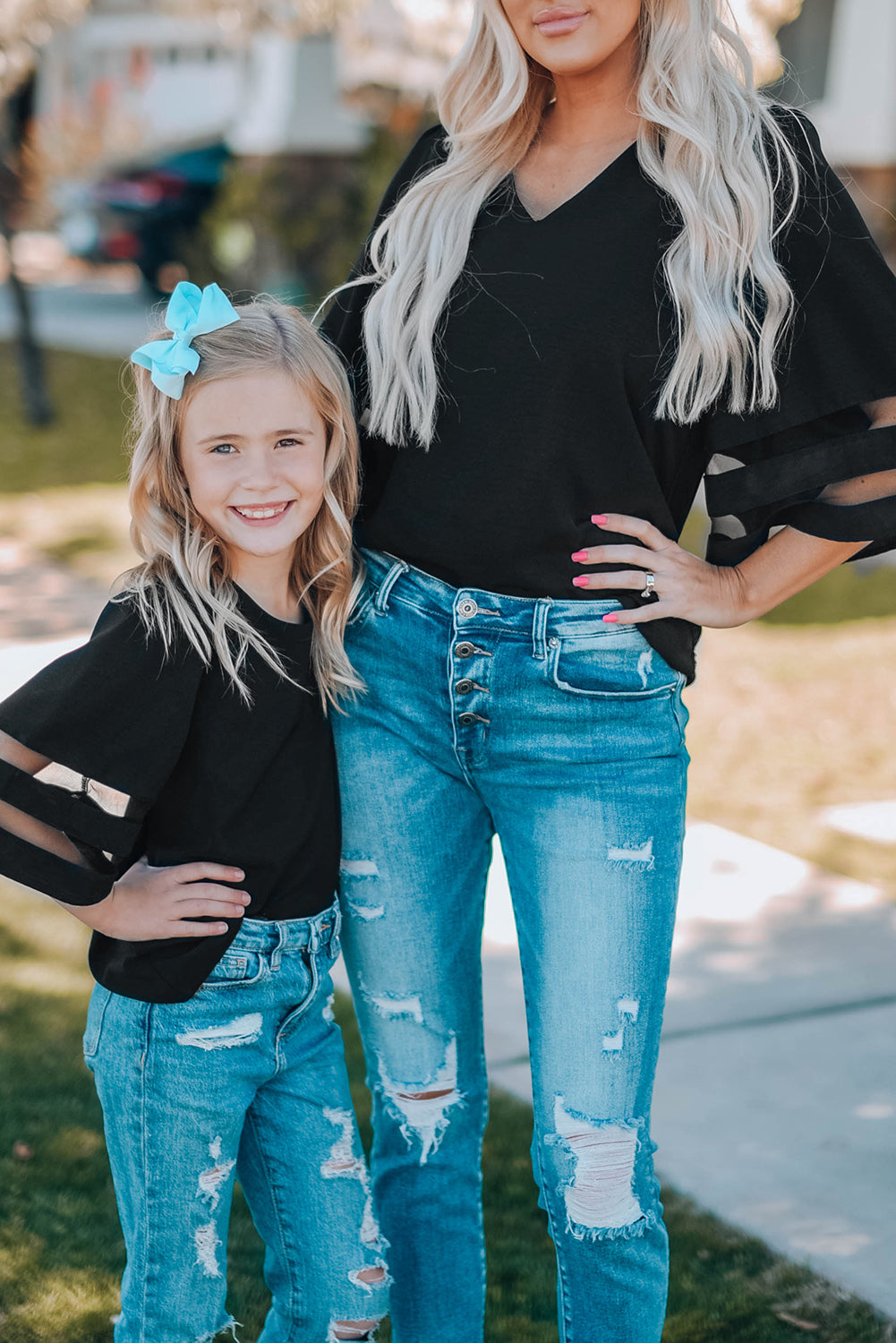 Black Girl's 3/4 Bell Sleeve Mesh Panel Blouse featuring sheer mesh panels and a stylish peek-a-boo back.