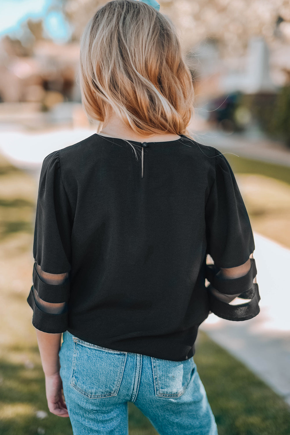 Black Girl's 3/4 Bell Sleeve Mesh Panel Blouse featuring sheer mesh panels and a stylish peek-a-boo back.
