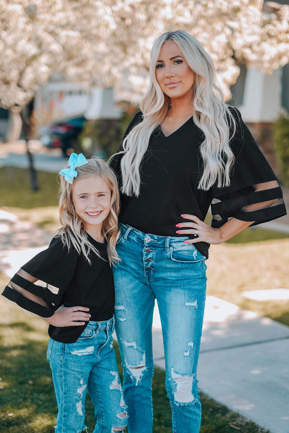 Black Girl's 3/4 Bell Sleeve Mesh Panel Blouse featuring sheer mesh panels and a stylish peek-a-boo back.