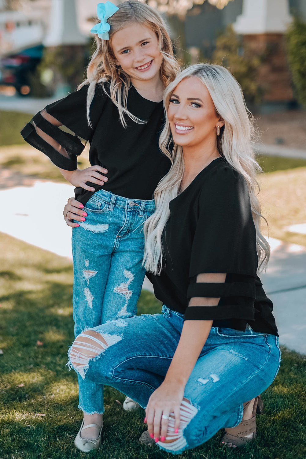 Black Girl's 3/4 Bell Sleeve Mesh Panel Blouse featuring sheer mesh panels and a stylish peek-a-boo back.