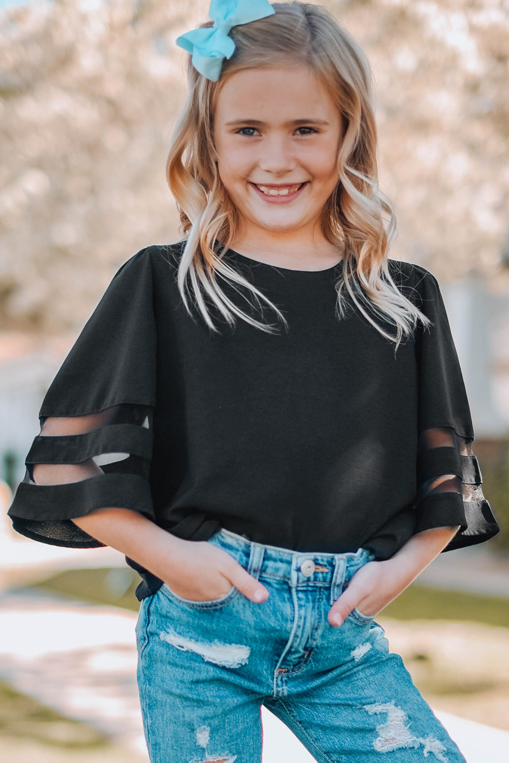 Black Girl's 3/4 Bell Sleeve Mesh Panel Blouse featuring sheer mesh panels and a stylish peek-a-boo back.
