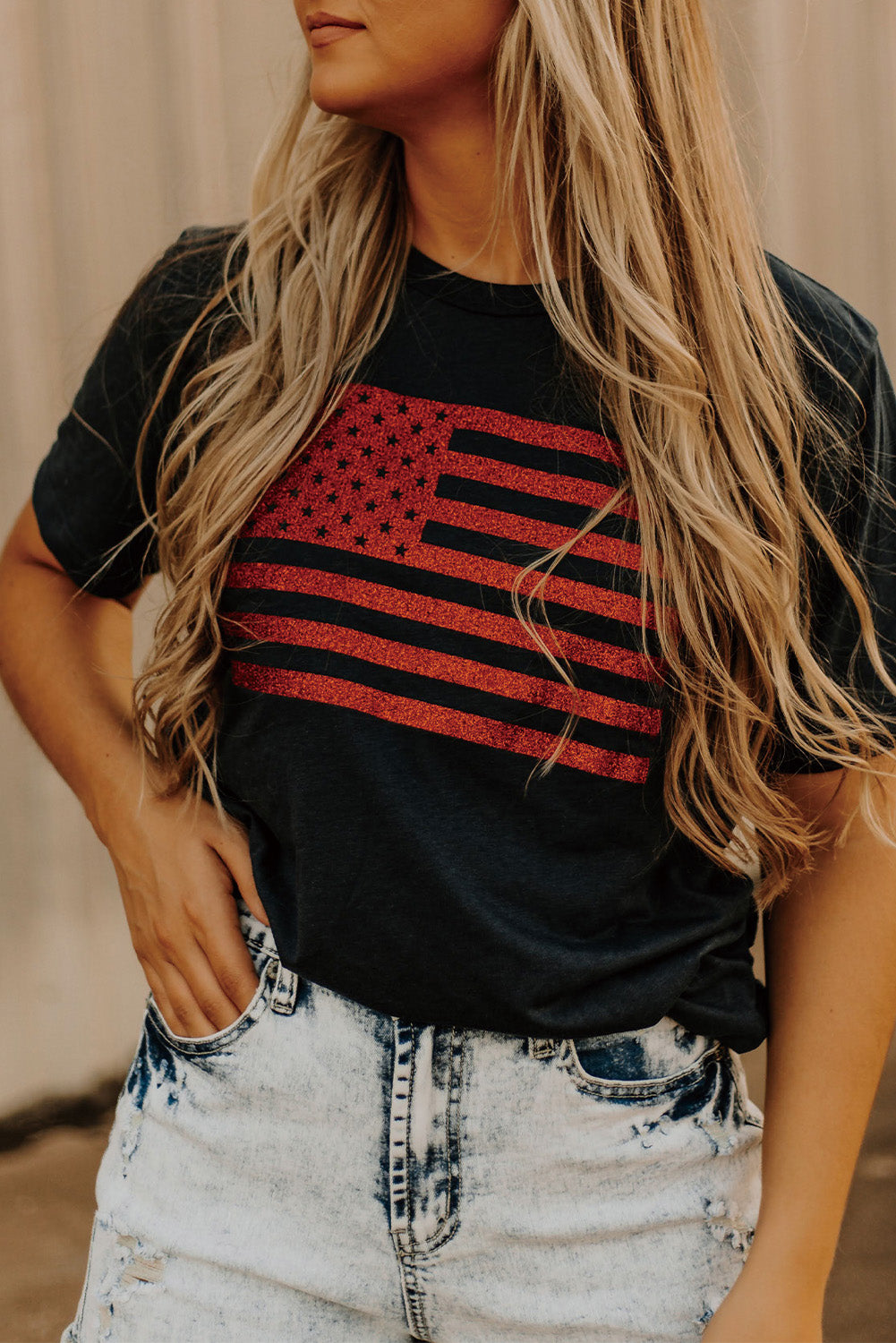 Black Glitter American Flag Round Neck Graphic T-Shirt showcasing a sparkling flag design on a black background.