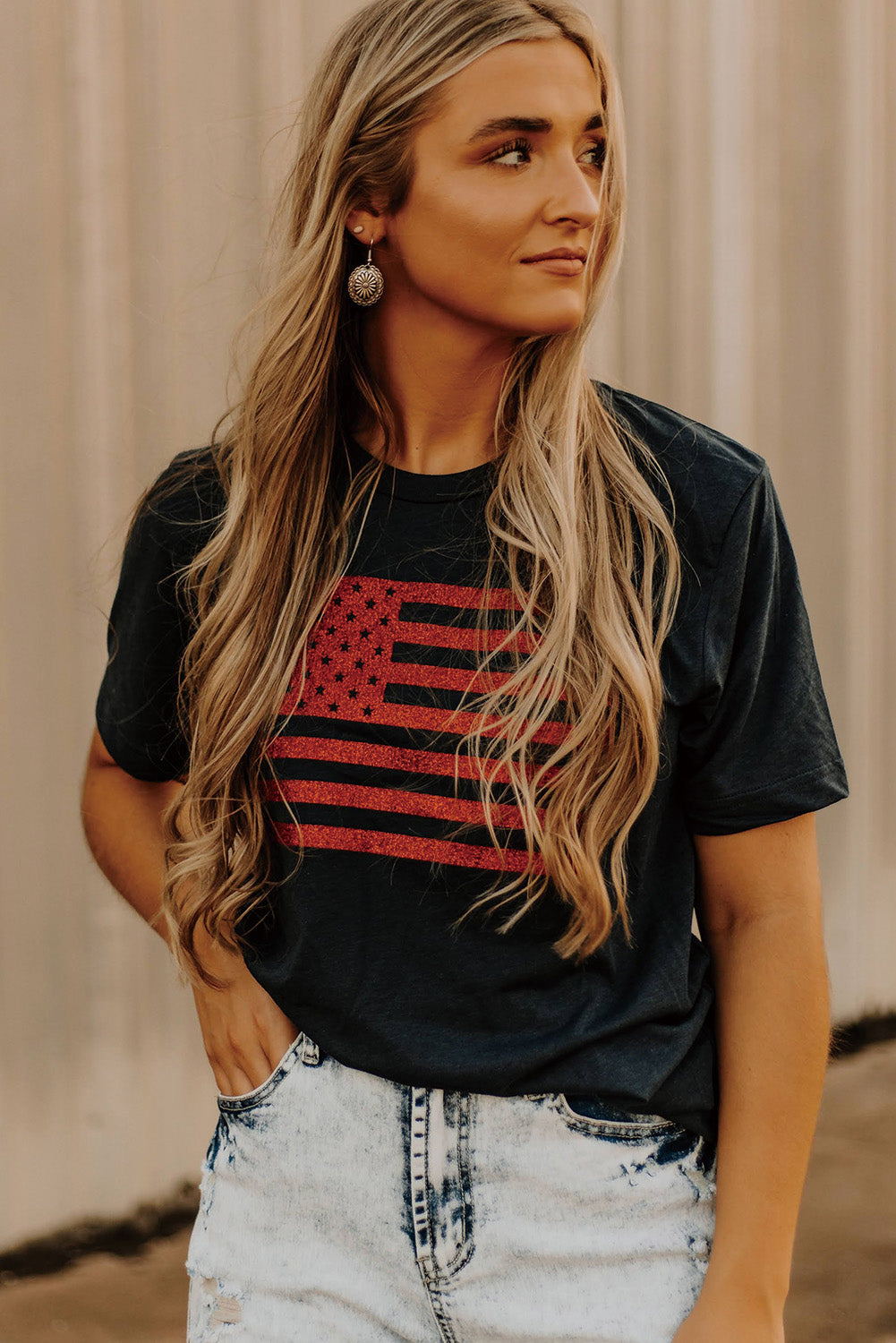 Black Glitter American Flag Round Neck Graphic T-Shirt showcasing a sparkling flag design on a black background.