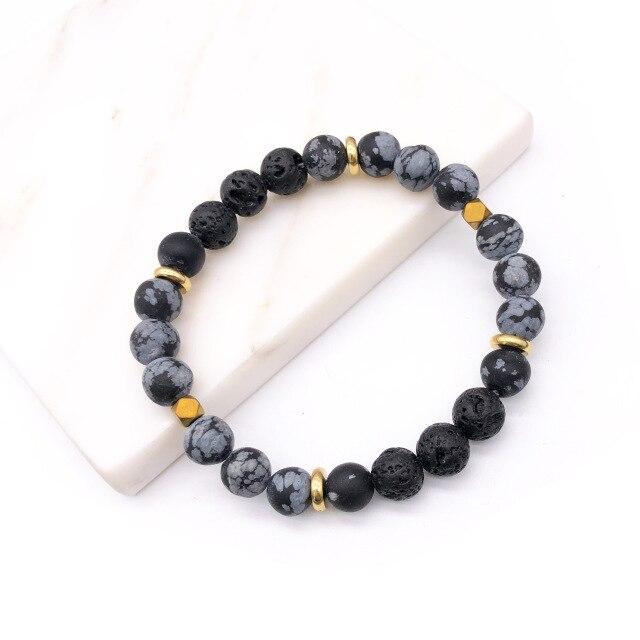 A stylish black lava stone bracelet designed for aromatherapy, featuring natural porous stones that absorb essential oils.