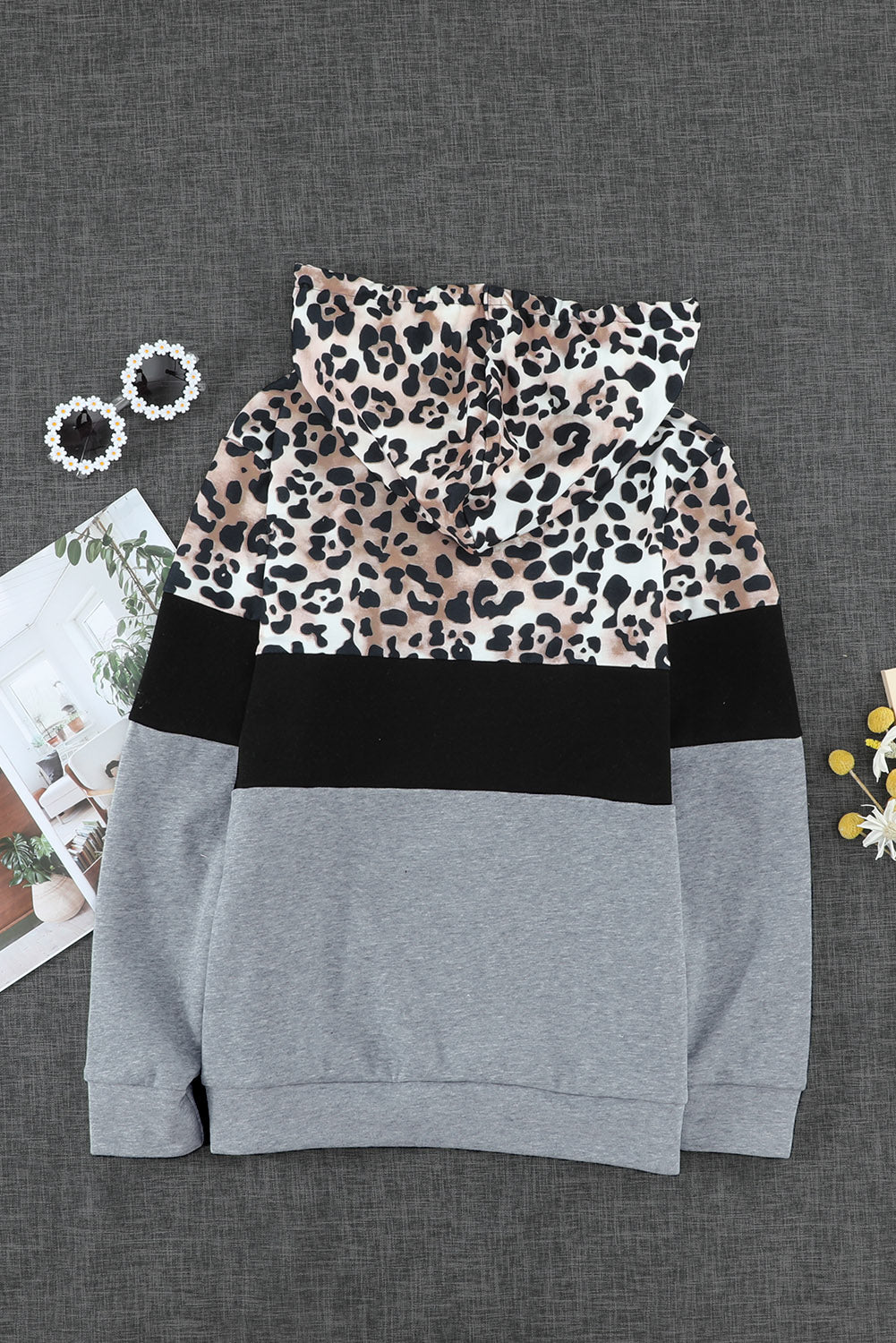 Black Leopard Splicing Kangaroo Pocket Drawstring Hoodie featuring camouflage and leopard print design with a wide neckline and kangaroo pocket.