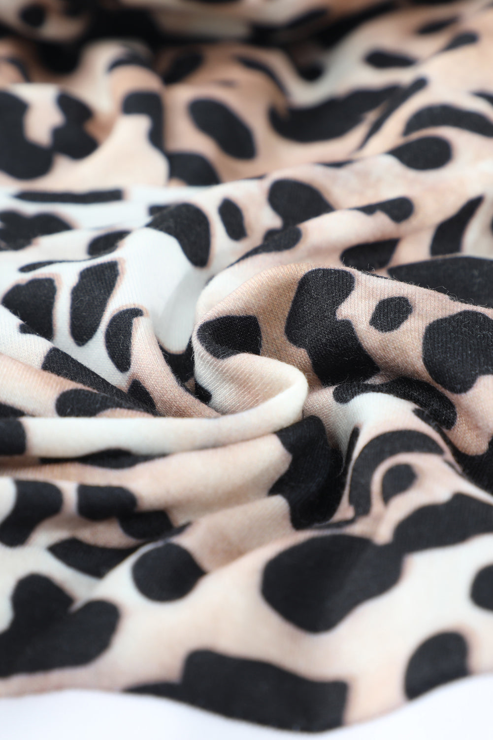 Black Leopard Splicing Kangaroo Pocket Drawstring Hoodie featuring camouflage and leopard print design with a wide neckline and kangaroo pocket.