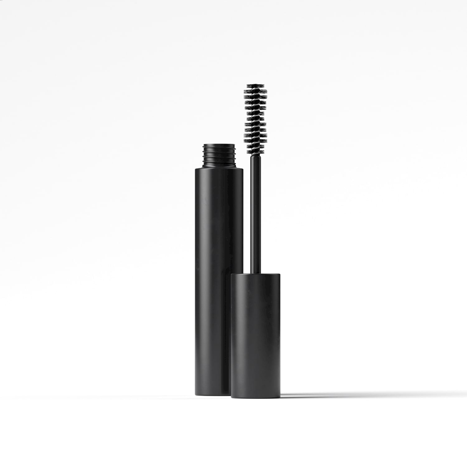A sleek tube of Black Mascara with a wand, showcasing its water-resistant formula and creamy texture.