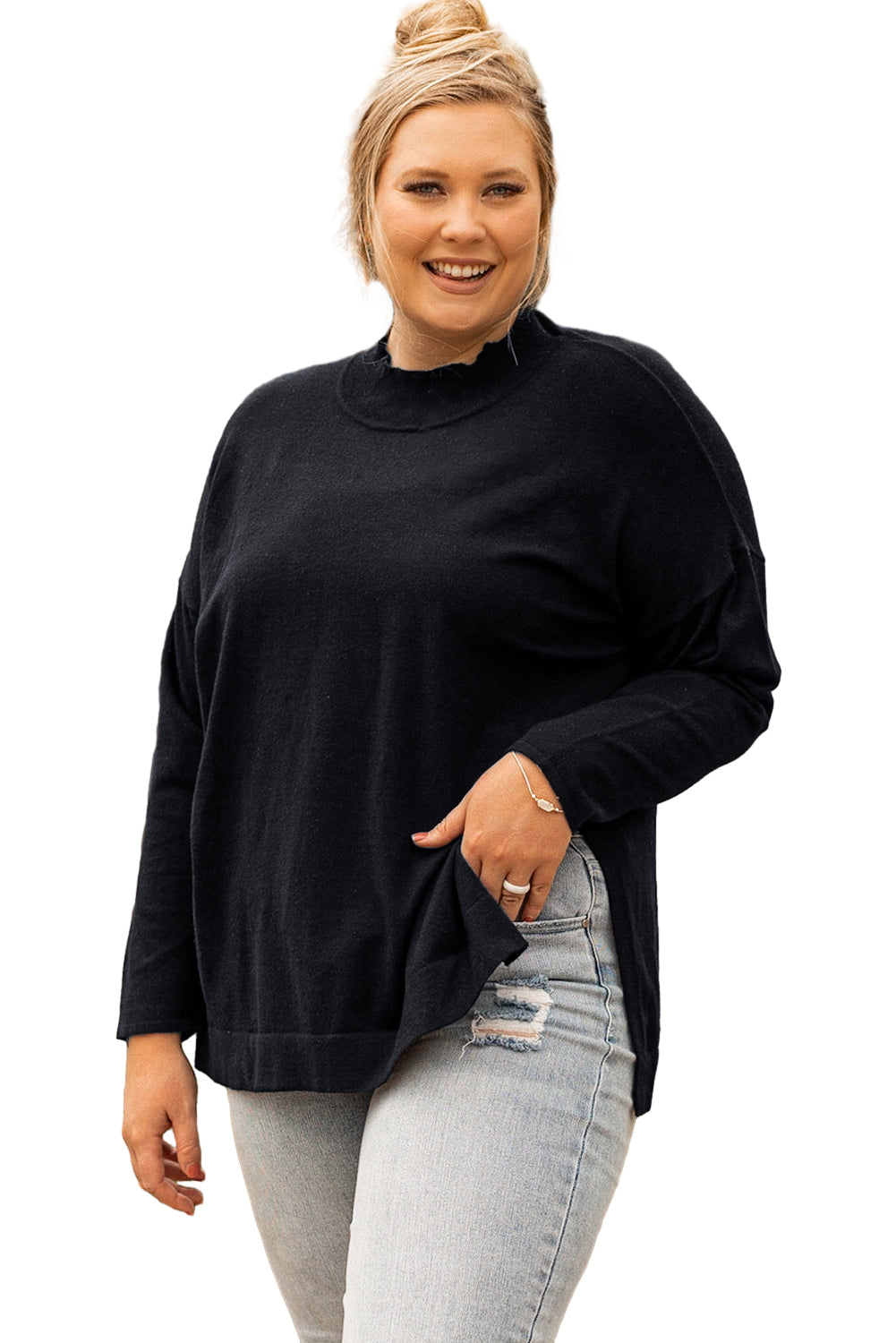 Black plus size loose sweater with side slits and high neck design, showcasing a relaxed fit and stylish look.