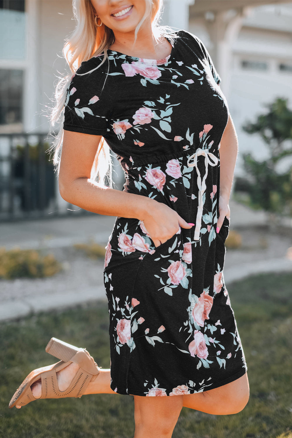 Black short sleeve casual floral dress with pockets and drawstring waist, perfect for summer outings.