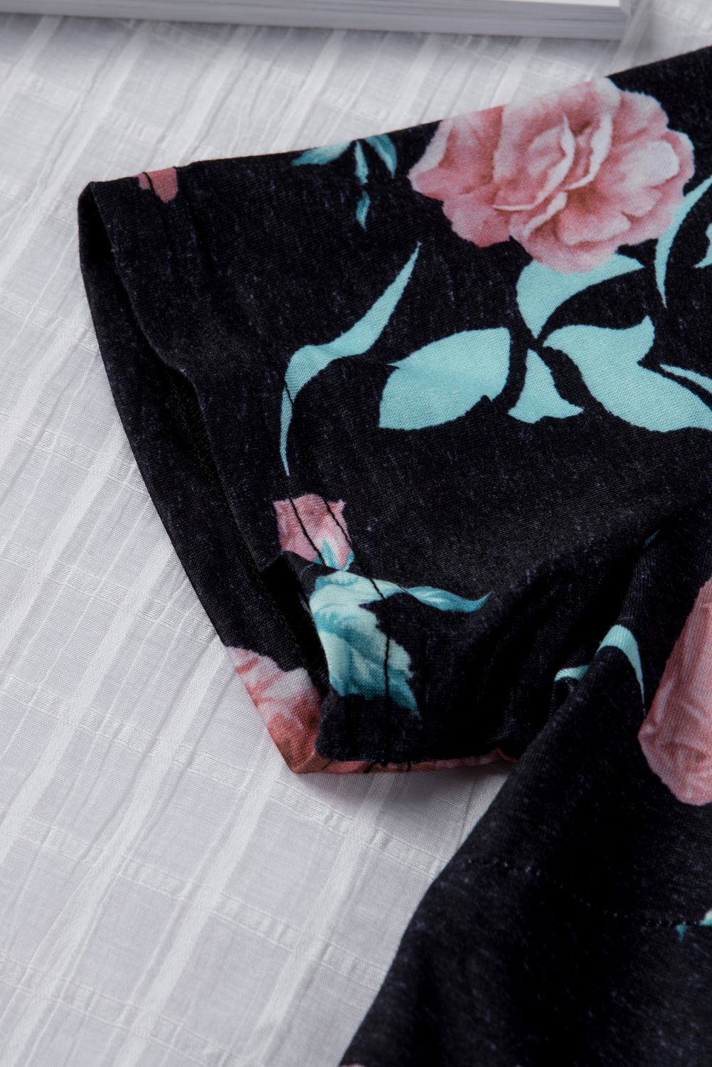 Black short sleeve casual floral dress with pockets and drawstring waist, perfect for summer outings.