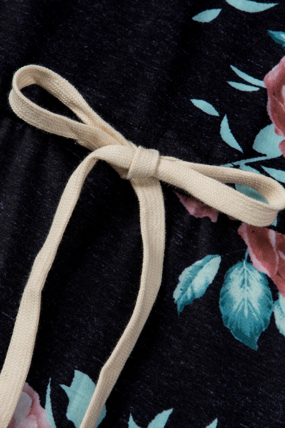 Black short sleeve casual floral dress with pockets and drawstring waist, perfect for summer outings.