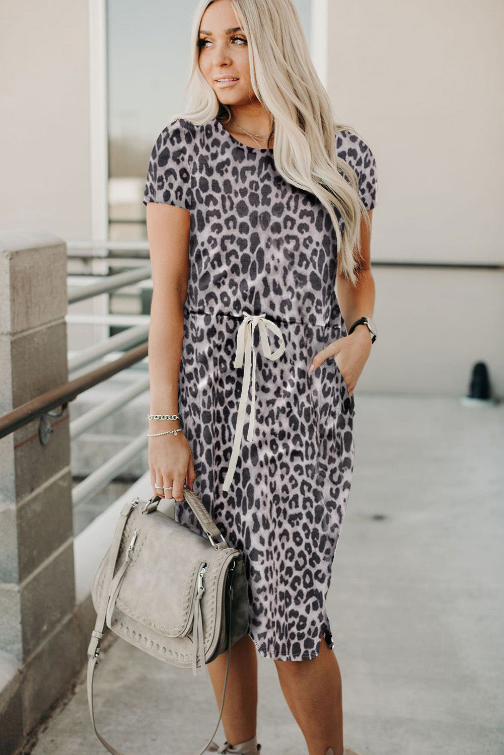Black short sleeve casual floral dress with pockets and drawstring waist, perfect for summer outings.