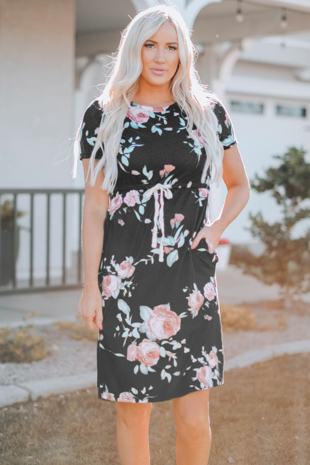 Black short sleeve casual floral dress with pockets and drawstring waist, perfect for summer outings.