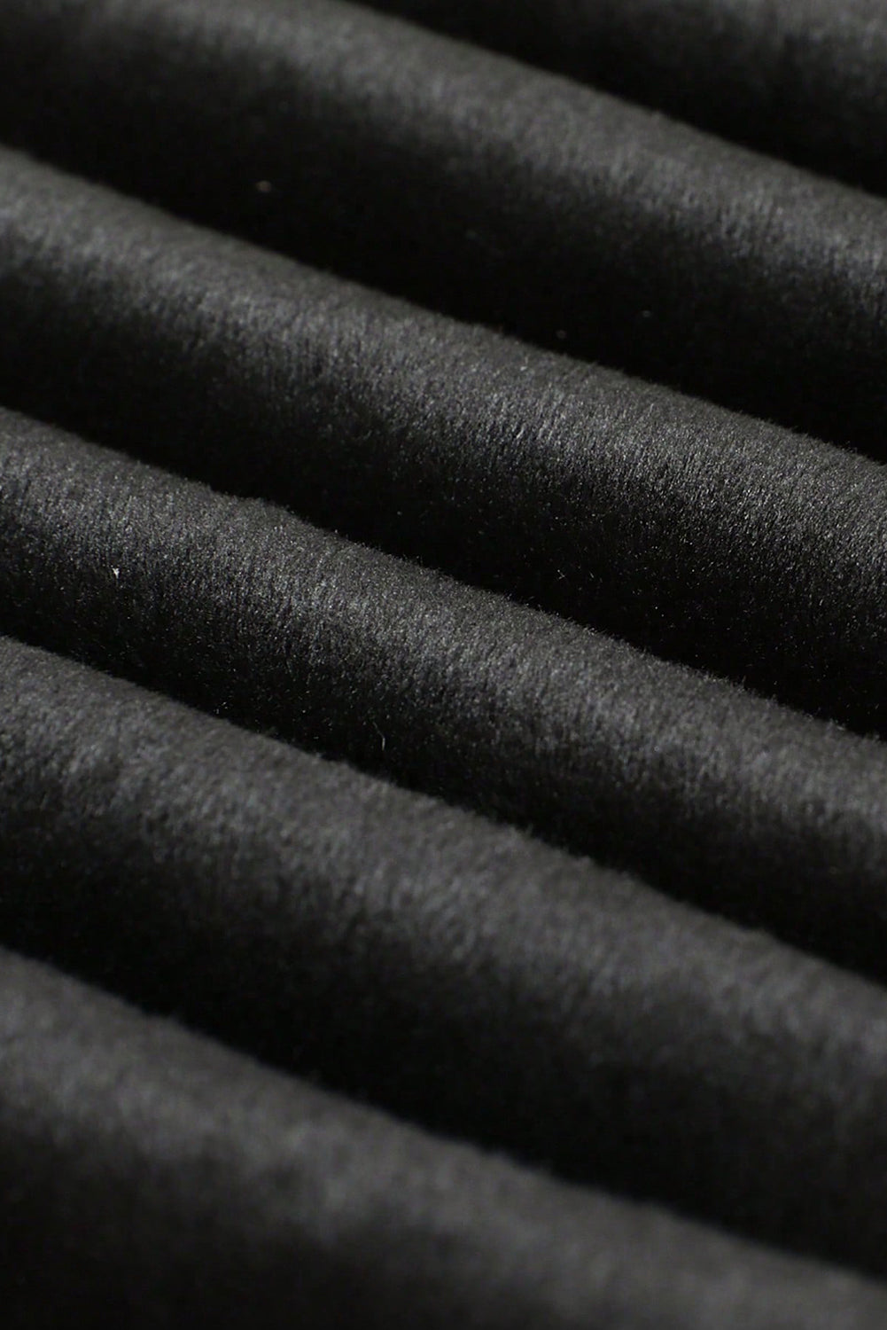 A pair of black solid high waist thermal lined leggings, showcasing their soft texture and stylish design, perfect for cold weather.