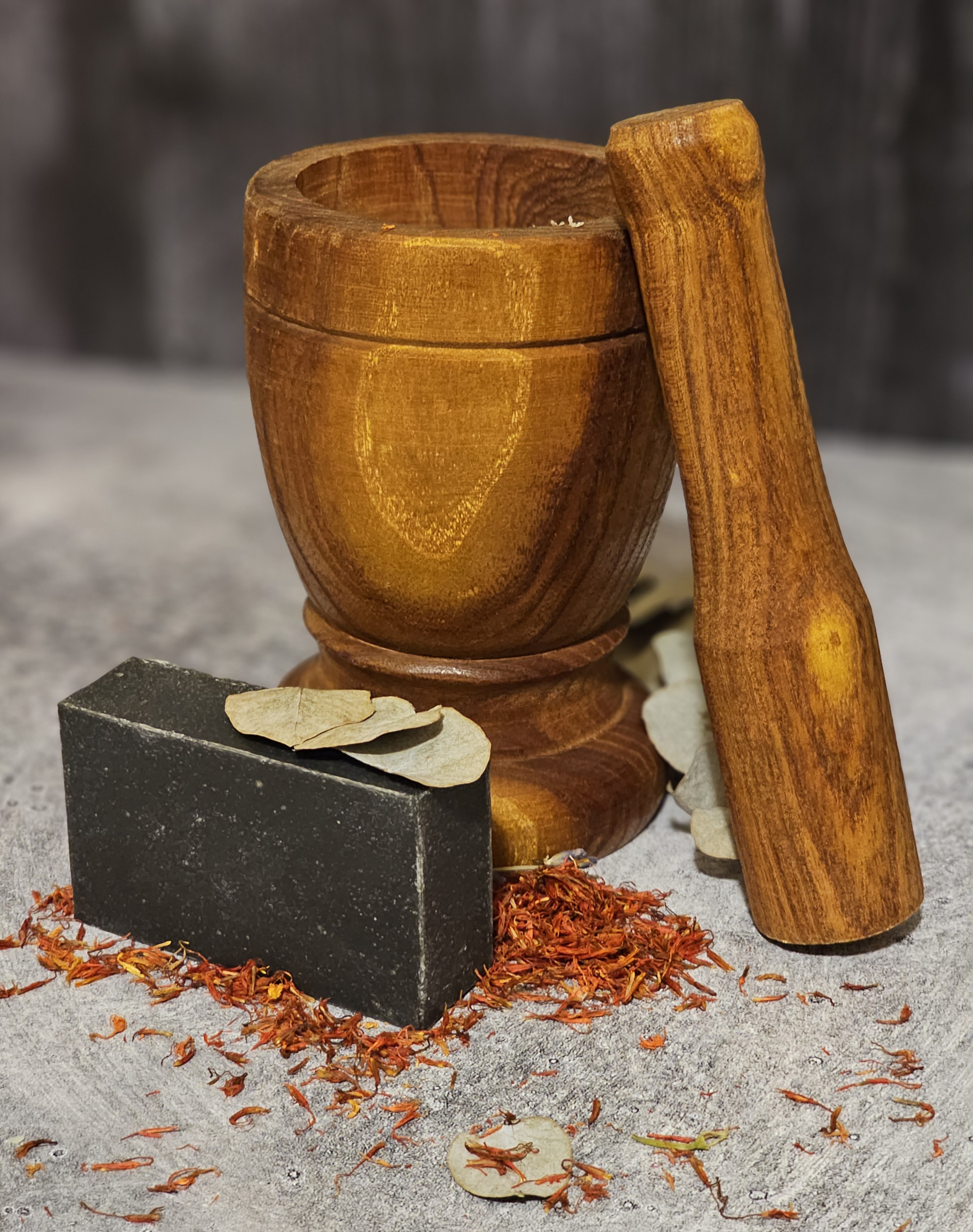 Black Tea Tree Activated Charcoal Soap bar with a rich texture, showcasing its organic ingredients and earthy colors.