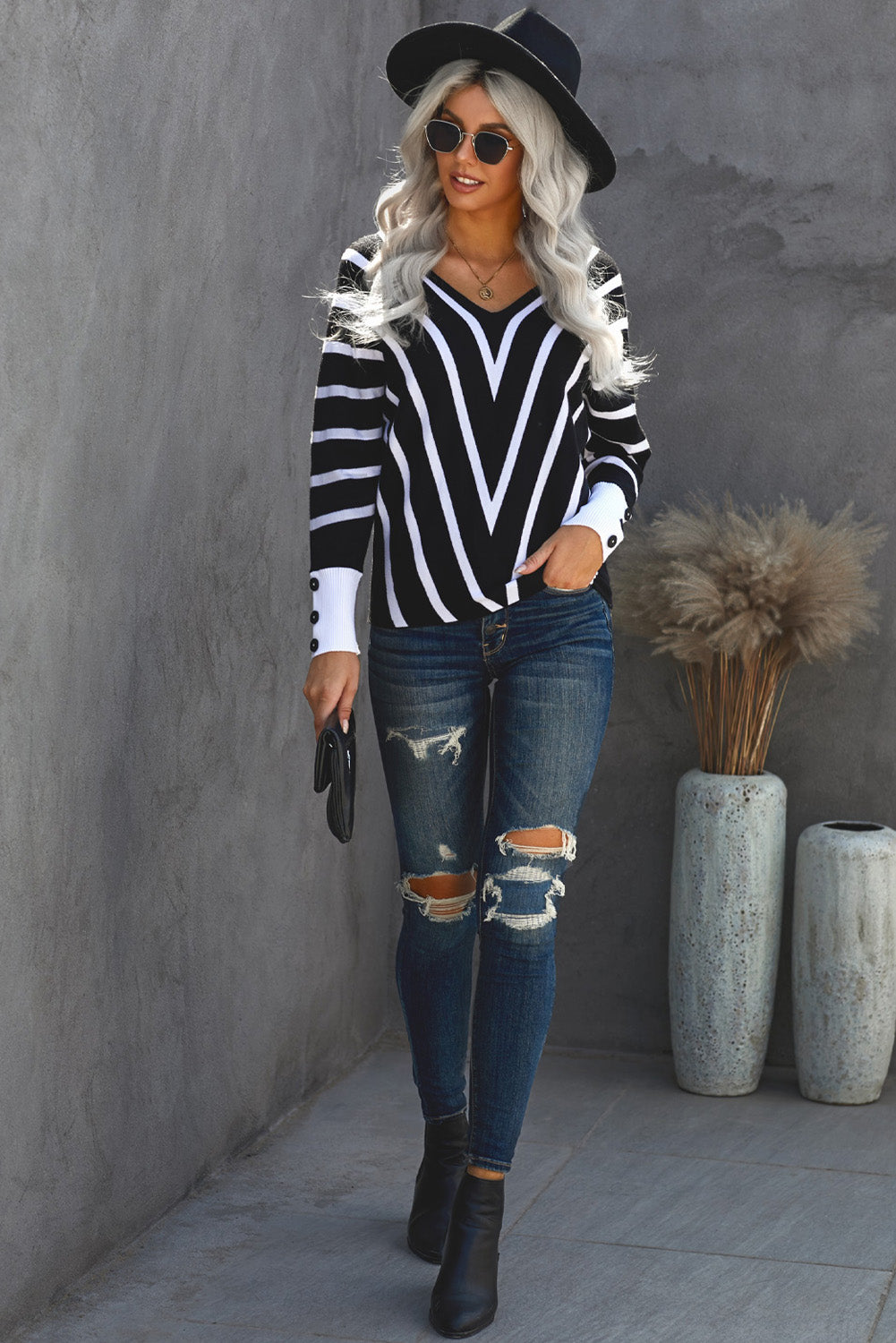 Black V Neck Popper Cuff Striped Casual Sweater featuring a deep V neck and elastic cuffs, styled with a classic chevron striped pattern.