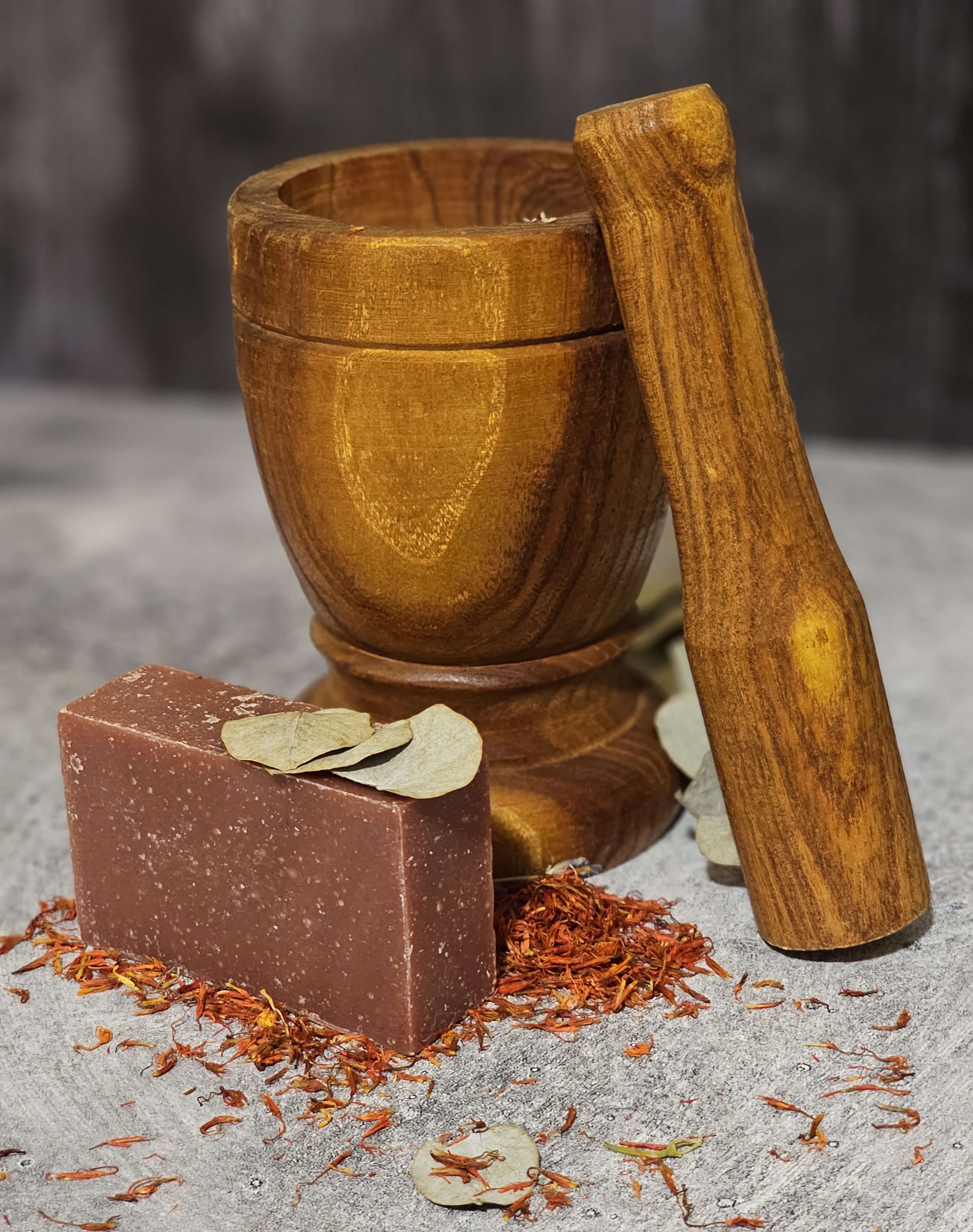 A vibrant Blood Orange Bergamot Soap bar showcasing its rich color and texture, emphasizing its organic and vegan ingredients.