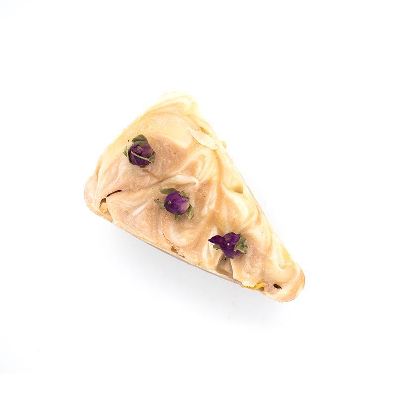 Blooming Marvellous Organic Soap with rose buds and pink swirls, showcasing its natural ingredients and elegant design.