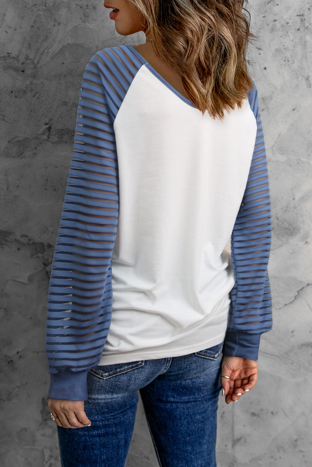 A stylish blue colorblock patchwork mesh long sleeve top featuring a big V neckline and elegant mesh sleeves, perfect for modern women.