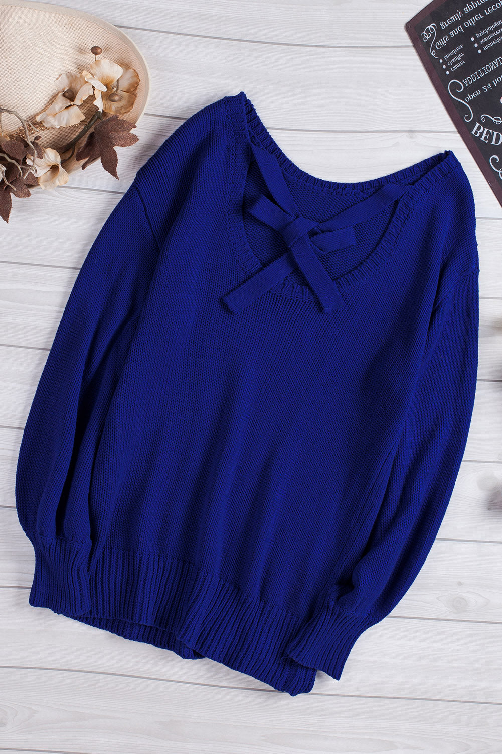 Blue drop shoulder sweater featuring a back cut-out and tie detail, showcasing a stylish and elegant design.