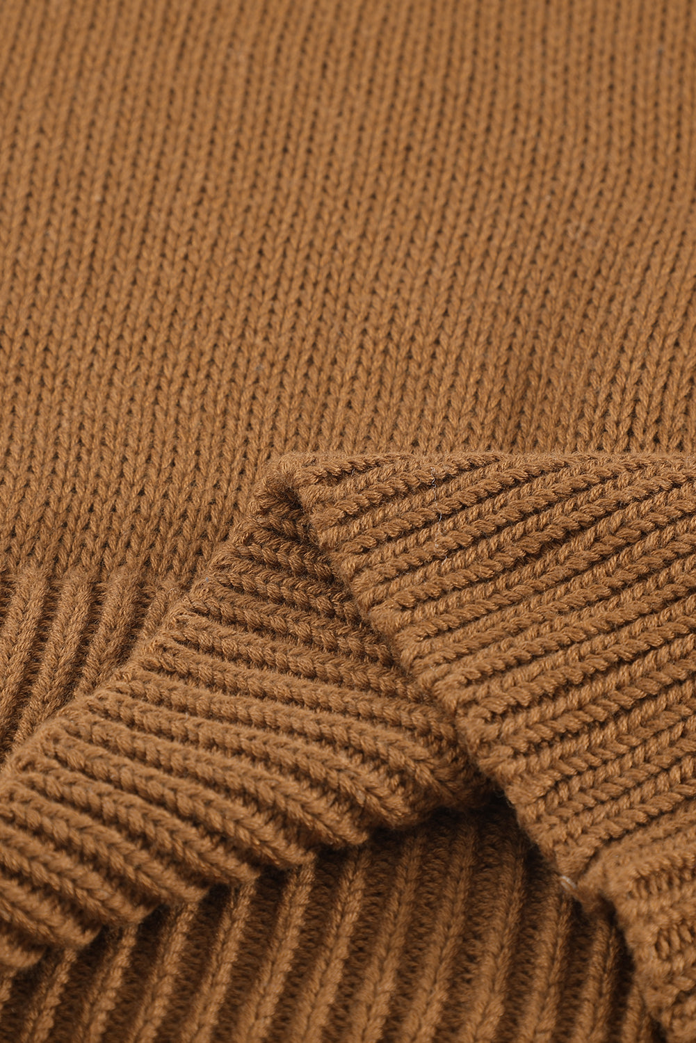 Blue drop shoulder sweater featuring a back cut-out and tie detail, showcasing a stylish and elegant design.