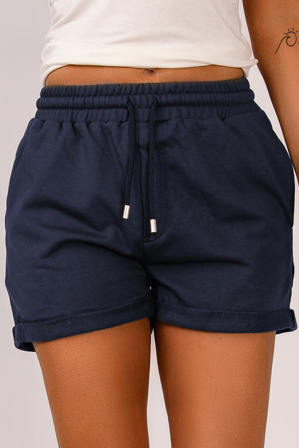 Blue tie waist cuffed lounge shorts with side pockets, perfect for summer wear.