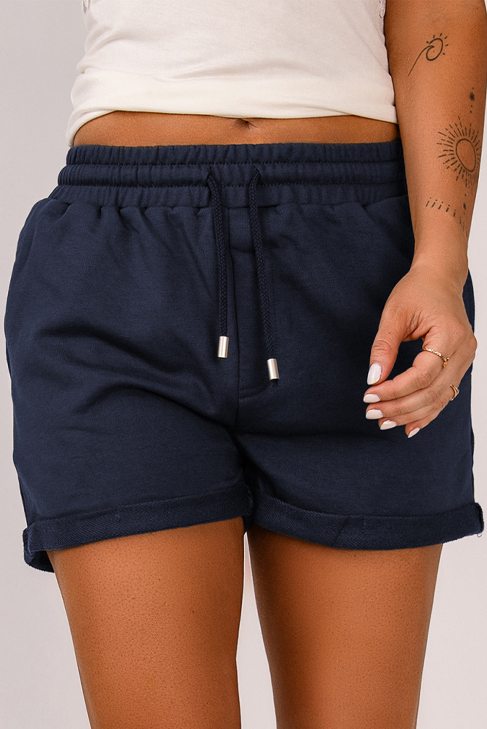 Blue tie waist cuffed lounge shorts with side pockets, perfect for summer wear.