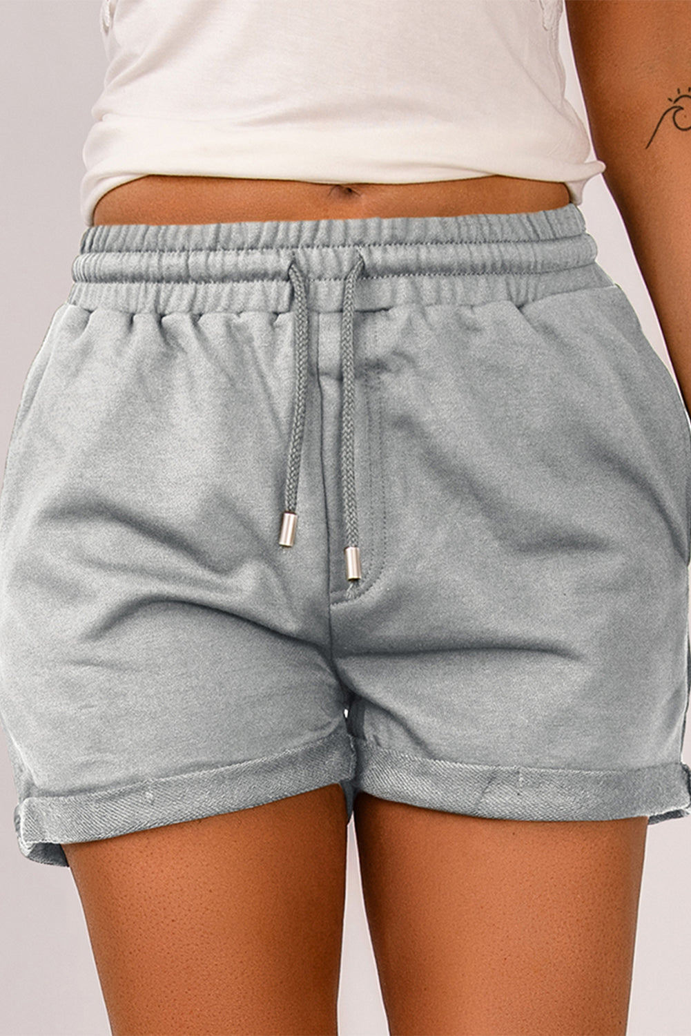 Blue tie waist cuffed lounge shorts with side pockets, perfect for summer wear.