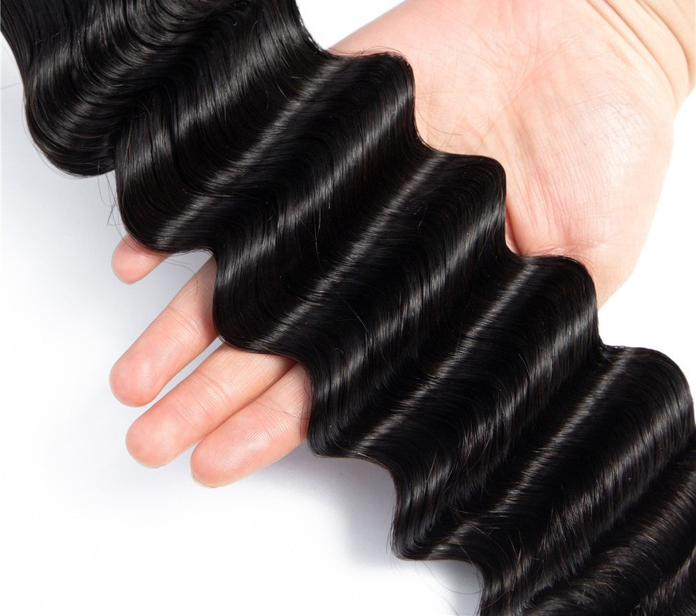 Brazilian 3/4 Fancy Deep Wavy Fumi Human Hair bundles with 4x4 Closure, showcasing luxurious waves and high-quality Swiss Lace.