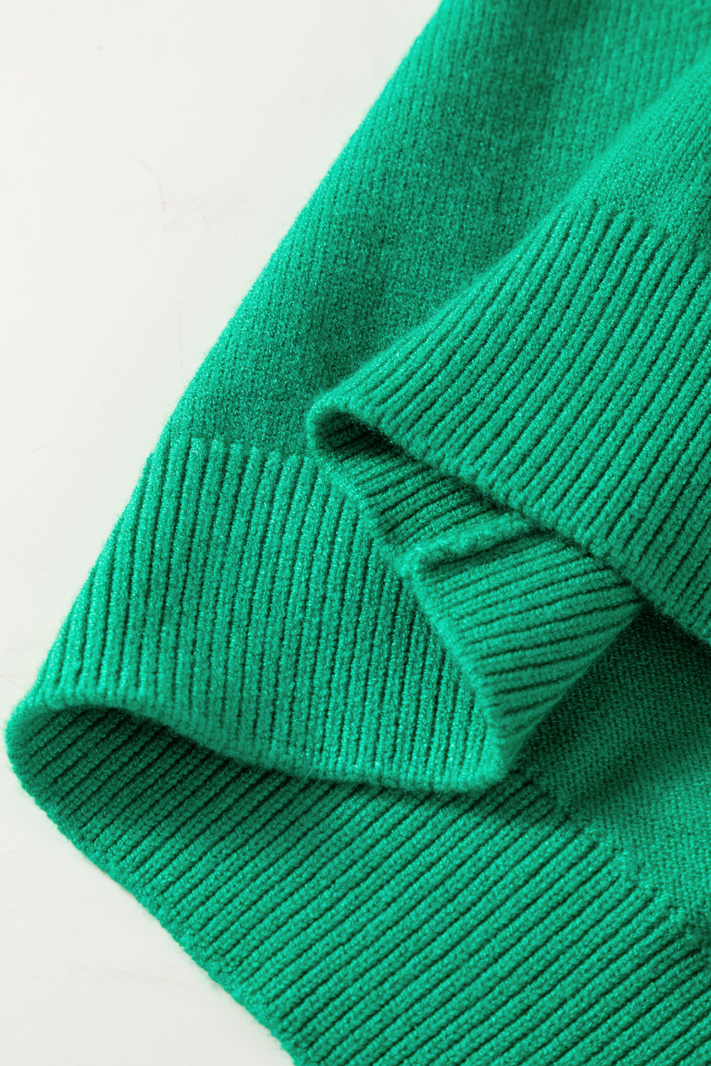 Bright green Christmas sweater featuring sequined JOYFUL graphic, perfect for festive occasions.