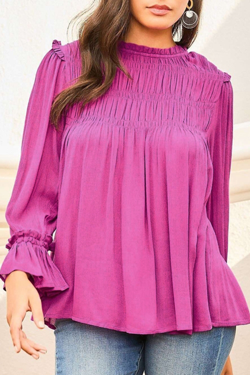 Bright pink blouse featuring shirred design, buttoned keyhole back, and flounce sleeves, perfect for stylish women.