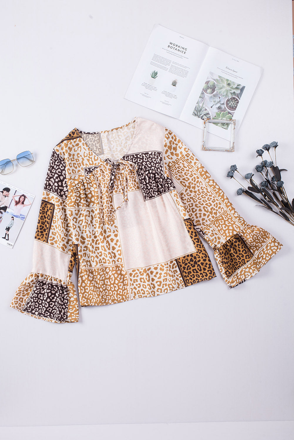 Brown Colorblock Leopard Ribbon Tie Blouse featuring a V-neck and long sleeves, designed for a relaxed fit.