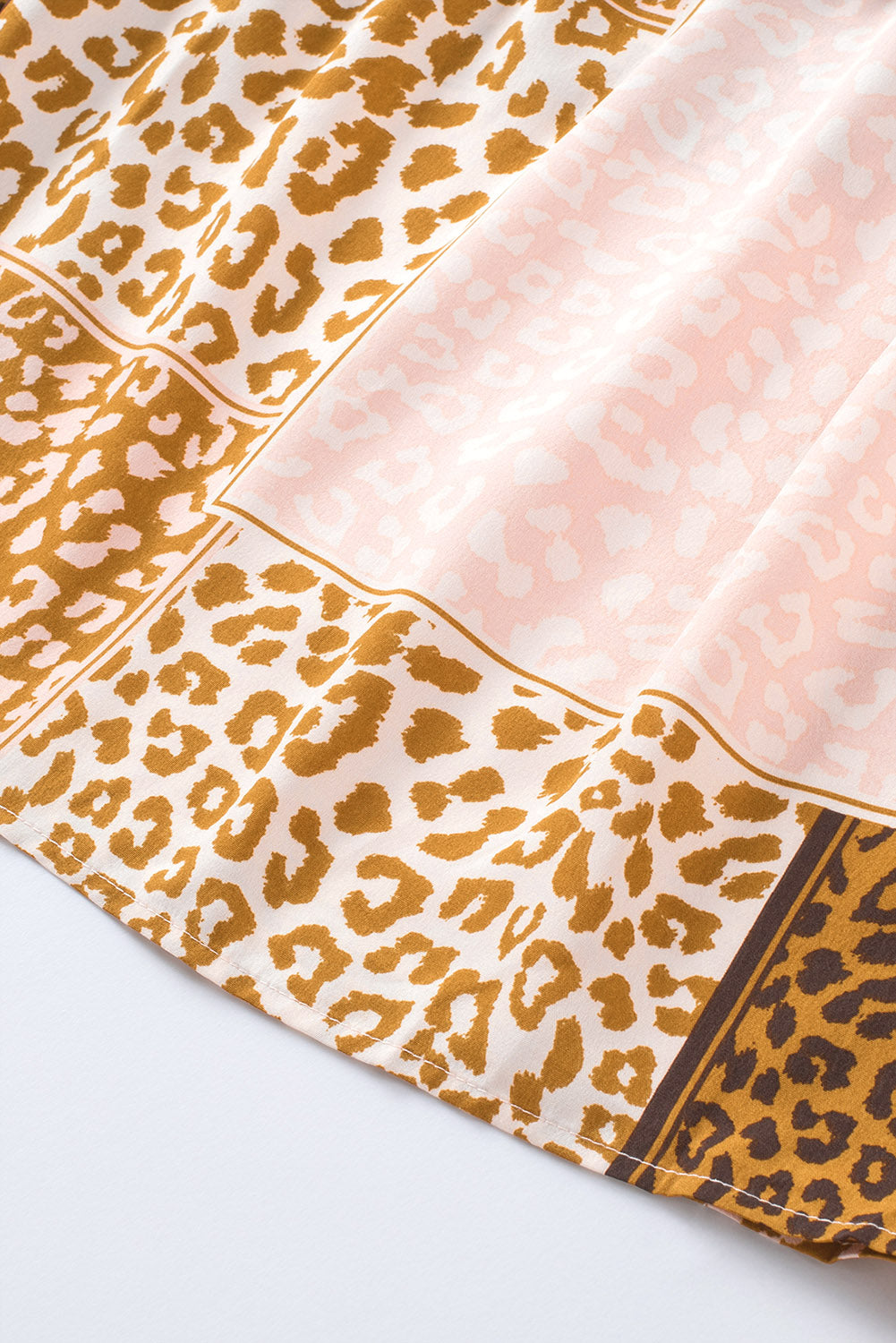 Brown Colorblock Leopard Ribbon Tie Blouse featuring a V-neck and long sleeves, designed for a relaxed fit.