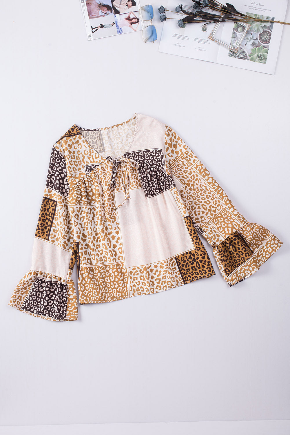 Brown Colorblock Leopard Ribbon Tie Blouse featuring a V-neck and long sleeves, designed for a relaxed fit.